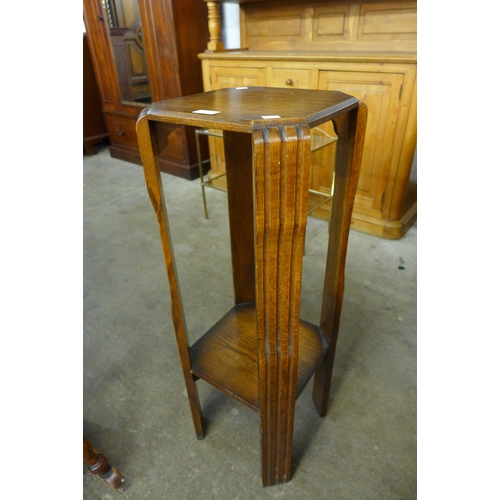 187 - An Art Deco oak jardiniere stand