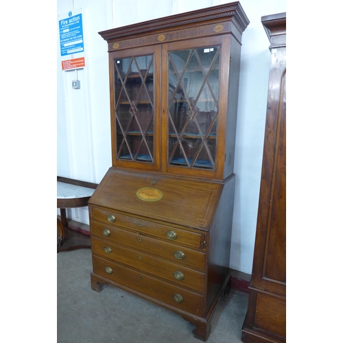 191 - A George III style inlaid mahogany bureau bookcase