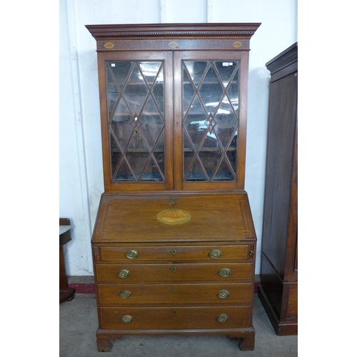 191 - A George III style inlaid mahogany bureau bookcase