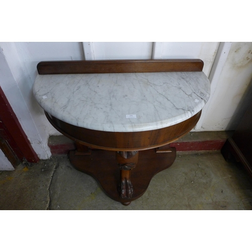 192 - A Victorian mahogany and marble topped demi-lune washstand