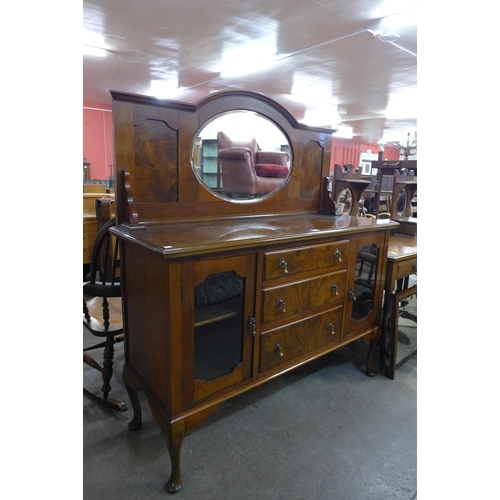 193 - An early 20th Century figured walnut mirrorback sideboard