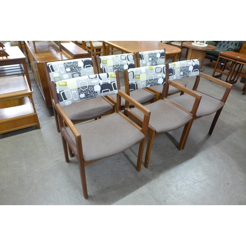 22 - A set of six teak dining chairs