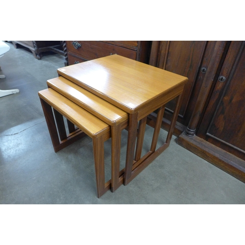 27 - A teak nest of tables