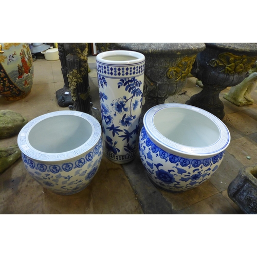 283 - Two oriental blue and white porcelain fish bowls and a stick stand