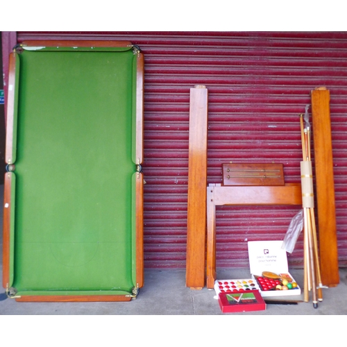 297 - A mahogany snooker table, with accessories