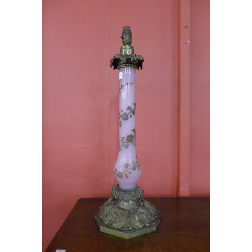 326 - An early 20th Century gilt bronze and pink glass table lamp