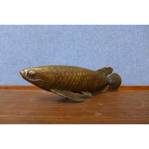 335A - An oriental bronze figure of a fish