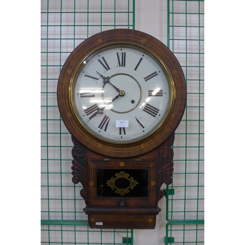 344 - A 19th Century inlaid rosewood drop-dial wall clock, Waterbury Clock Co. USA