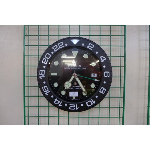 346 - A Rolex style dealer's display wall clock