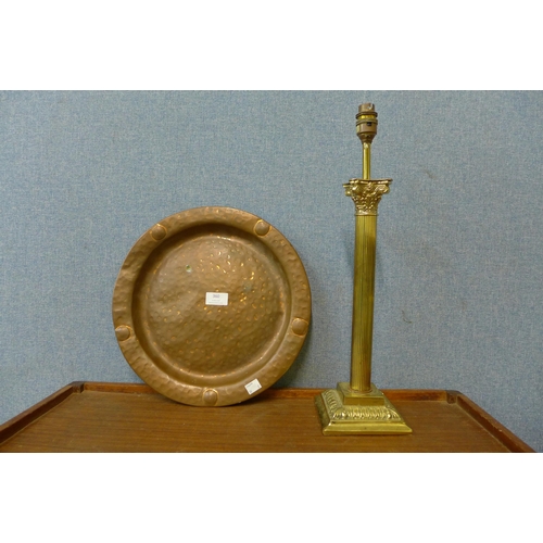 360 - A brass Corinthian column table lamp and an Arts and Crafts copper tray