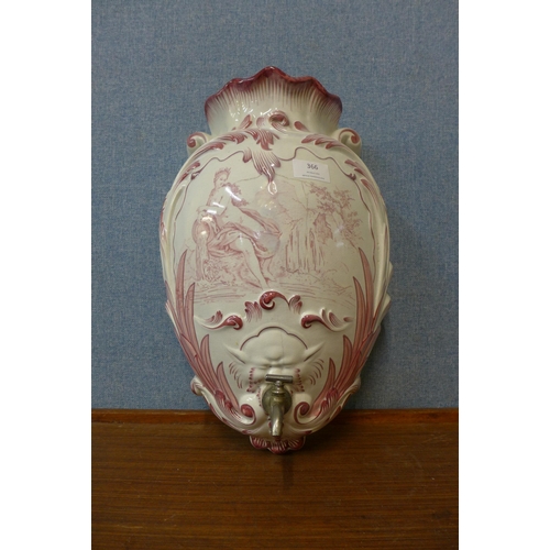 366 - An early 20th Century French porcelain water font/wall pocket