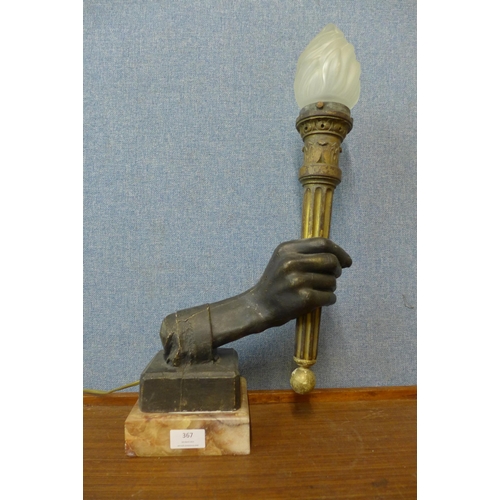 367 - A French Art Deco style table lamp in the form of a hand holding a torch, 52cms h