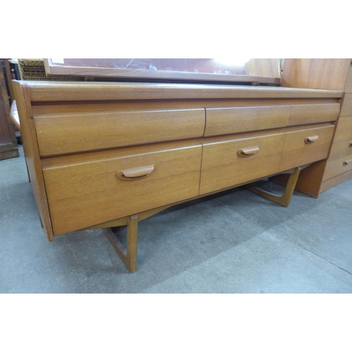 37 - A William Lawrence teak chest of drawers and dressing table