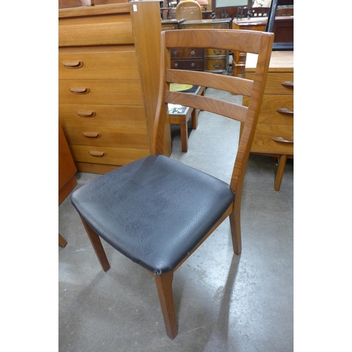 39 - A set of four Nathan teak dining chairs