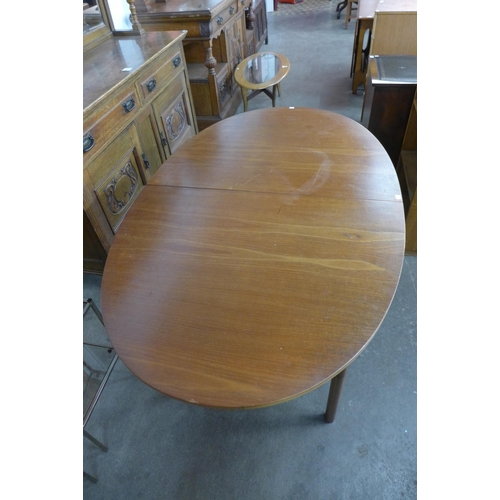 39A - A McIntosh teak oval extending dining table