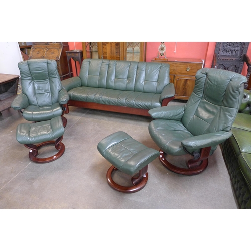 45 - A Norwegian Ekornes beech and green leather Stressless five piece suite, comprising; settee, two arm... 