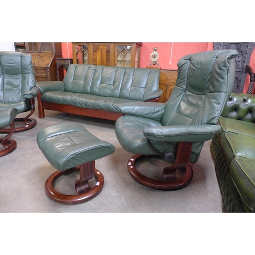 45 - A Norwegian Ekornes beech and green leather Stressless five piece suite, comprising; settee, two arm... 