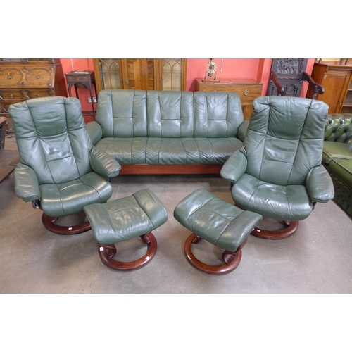 45 - A Norwegian Ekornes beech and green leather Stressless five piece suite, comprising; settee, two arm... 