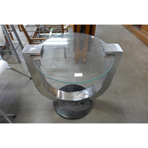 46 - A circular chrome and glass coffee table