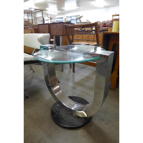 46 - A circular chrome and glass coffee table