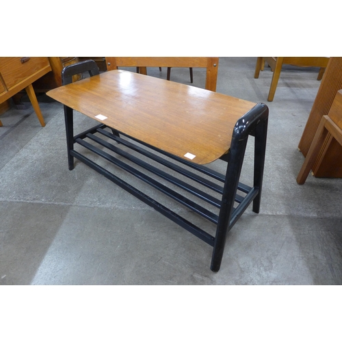 57 - A tola wood and black coffee table