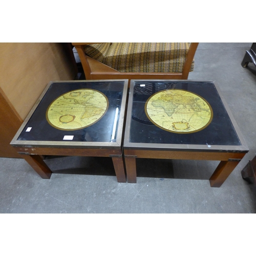 59 - A pair of teak and brass mounted occasional tables, inset with maps of the world