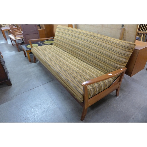 63 - A Danish teak and fabric upholstered daybed sofa