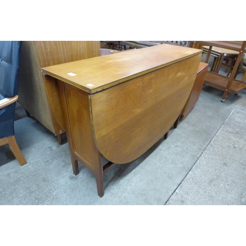 68 - A teak drop leaf table