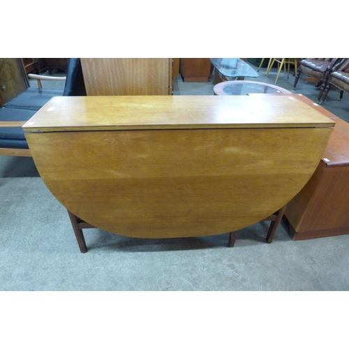 68 - A teak drop leaf table