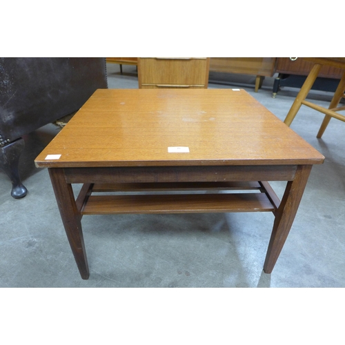 76 - A small teak coffee table