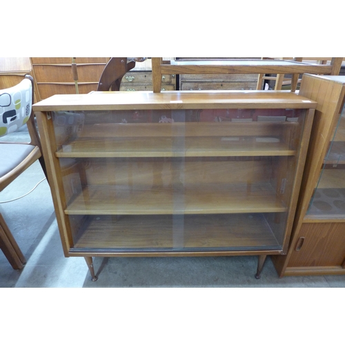 79 - A small teak bookcase