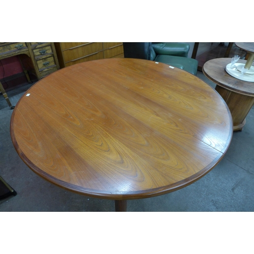 8 - A G-Plan Fresco teak circular extending dining table