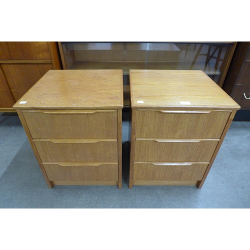 81 - A pair of teak bedside chests