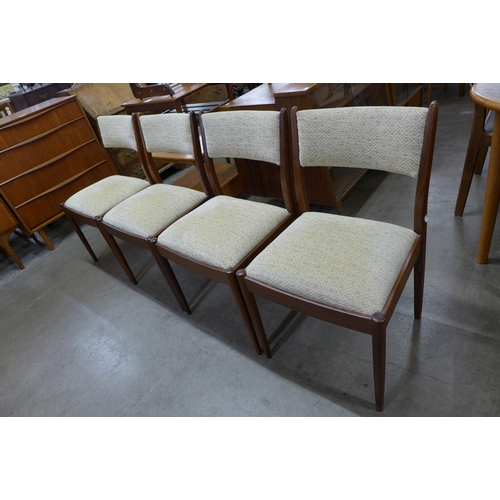 9 - A set of four teak dining chairs