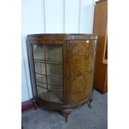 96 - An early 20th Century burr walnut demi lune side cabinet