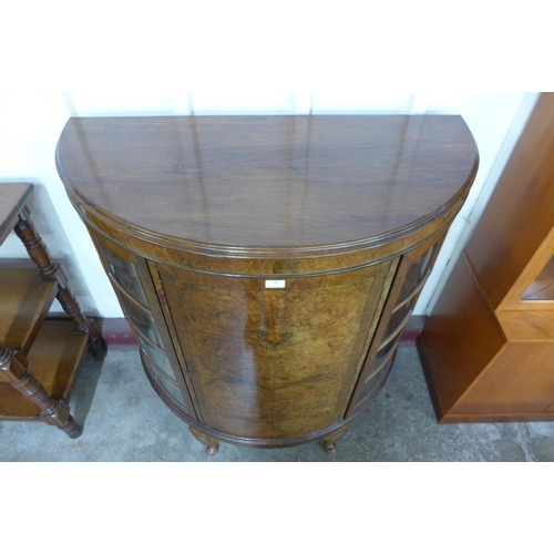 96 - An early 20th Century burr walnut demi lune side cabinet