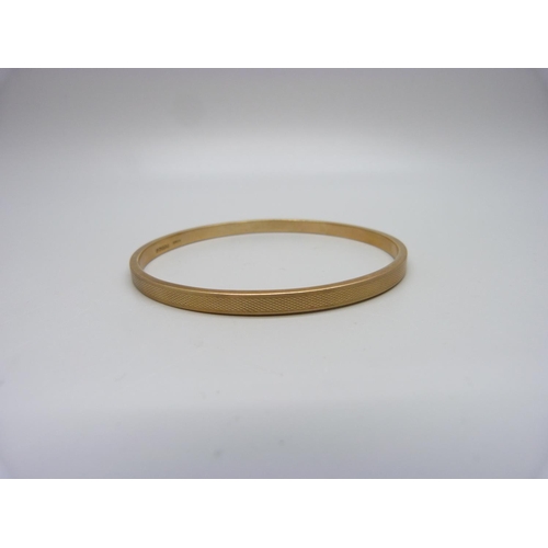 1002 - A 9ct rose gold bangle, Birmingham 1928, 6.8g, 69mm