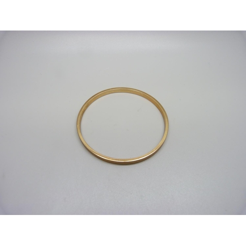 1002 - A 9ct rose gold bangle, Birmingham 1928, 6.8g, 69mm