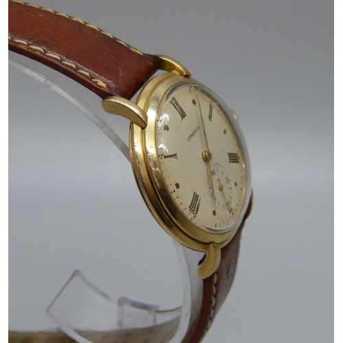 1007 - A 9ct gold Longines wristwatch, 34mm case