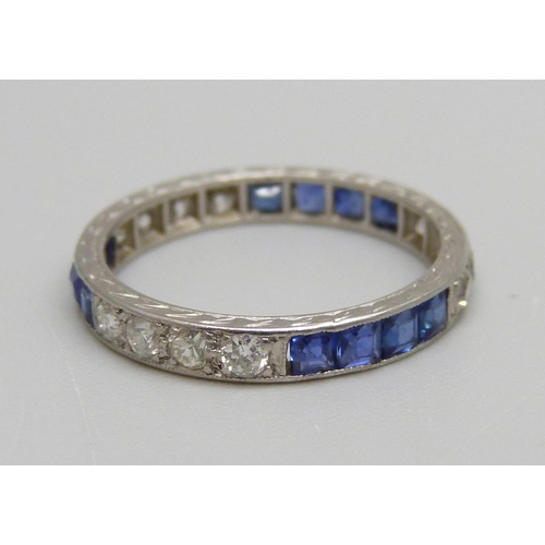 1008 - A white metal, white and blue stone eternity ring, test as white sapphires, 2.1g, K