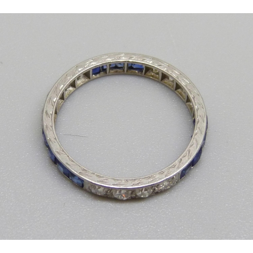 1008 - A white metal, white and blue stone eternity ring, test as white sapphires, 2.1g, K