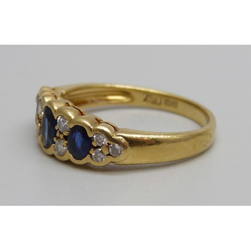 1017 - An 18ct gold, diamond and sapphire ring, 3.4g, M