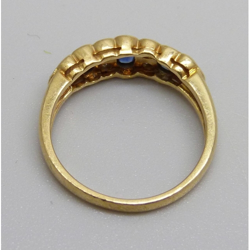 1017 - An 18ct gold, diamond and sapphire ring, 3.4g, M