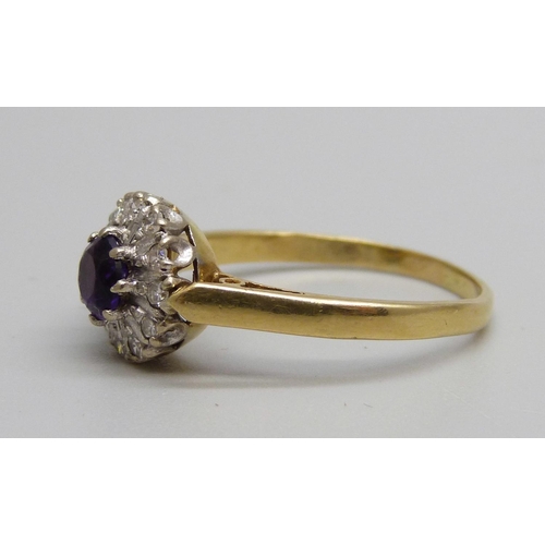 1022 - An 18ct gold, diamond and amethyst ring, 3.4g, Q