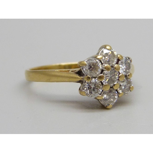 1024 - An 18ct gold and diamond cluster ring, 3.1g, K