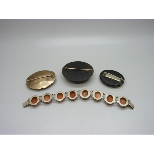 1025 - Three Victorian brooches, one with inscription dated 1870, and a cameo bracelet