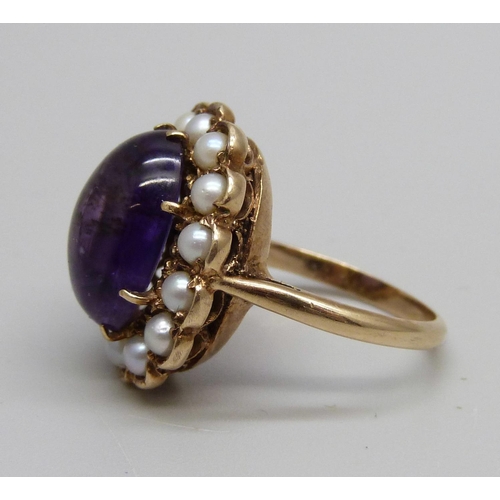 1029 - A Victorian 9ct gold, cabochon amethyst and seed pearl ring, 5.5g, J