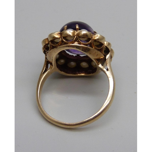 1029 - A Victorian 9ct gold, cabochon amethyst and seed pearl ring, 5.5g, J