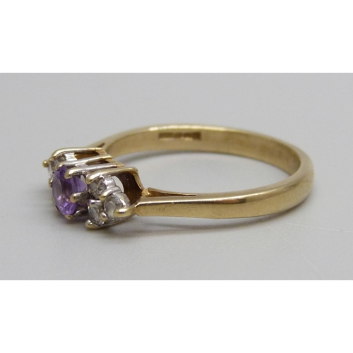 1033 - A 9ct gold, amethyst and white stone ring, 2.4g, O