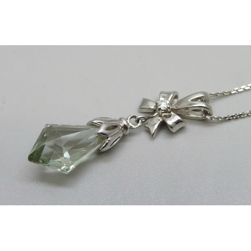 1034 - A 9ct white gold, green amethyst and diamond pendant, 5.7g